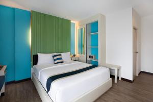 Postel nebo postele na pokoji v ubytování iCheck inn Chill Patong