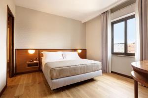 Voodi või voodid majutusasutuse Antum Hotel toas