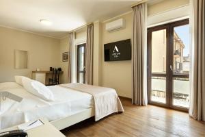 Voodi või voodid majutusasutuse Antum Hotel toas
