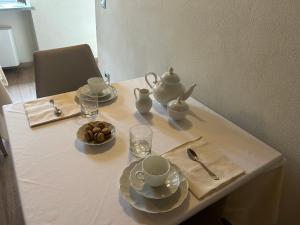 a table with a tea set on top of it at Vin dell'Olmo in Castagnole Lanze