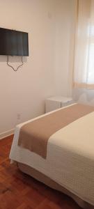 Cama ou camas em um quarto em Grande Hotel Amparo