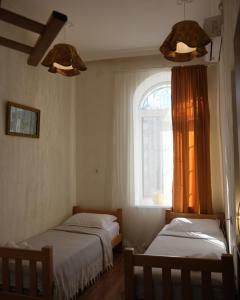 Postel nebo postele na pokoji v ubytování Hotel 1870