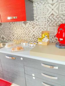 a kitchen with a counter with some food on it at B&B Mura 17 in Polistena +7 photos