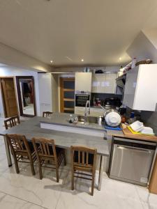 a kitchen with a table and chairs and a sink at Fomed in Brussels +27 photos
