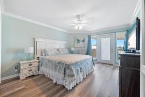 a bedroom with a bed and a ceiling fan at Lagoon Luxury in Gulf Shores