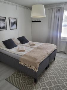 a bedroom with a large bed in a room at Cozy Arctic Heart in Rovaniemi