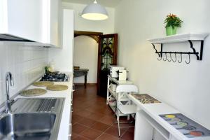 a kitchen with a sink and a counter top at Ecc3ntrico in Arezzo +4 photos