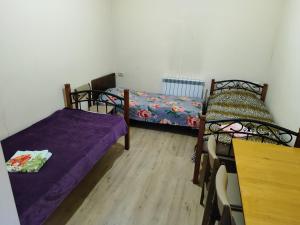 Postel nebo postele na pokoji v ubytování Vanand Guest House