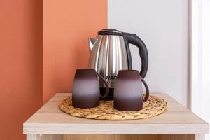 a tea pot sitting on top of a table at Himara City 33 - Central, Beach Access in Himare