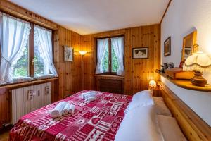 Ένα ή περισσότερα κρεβάτια σε δωμάτιο στο MAISON CLAUDE - Relax e verde in un'oasi di pace - COUR 0247
