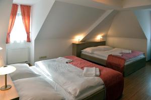 Giường trong phòng chung tại Resort Johanka