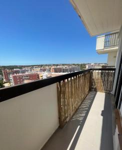 a balcony with a view of the city at Casa da Praia II na Torre Baleeira in Armação de Pêra