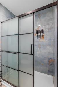 a glass door with two lights on a wall at Dog Friendly Home- Grill, Pool, Fire Pit by myBeach Vacation Rentals in Myrtle Beach