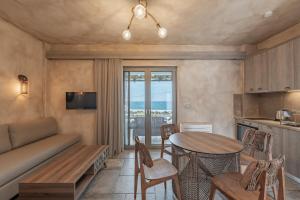 a living room with a couch and a table at Skyros Trias in Skiros