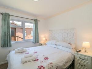 Ένα ή περισσότερα κρεβάτια σε δωμάτιο στο Bramley Lodge