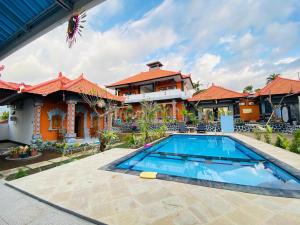 an image of a house with a swimming pool at Villa Jepun Lovina in Lovina