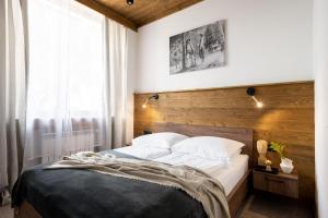 Posteľ alebo postele v izbe v ubytovaní Apartamenty Krupówki 20