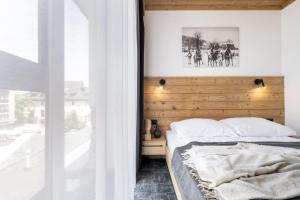 Posteľ alebo postele v izbe v ubytovaní Apartamenty Krupówki 20
