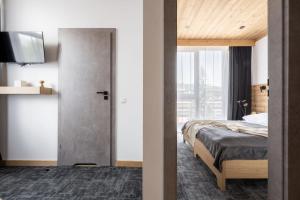 Posteľ alebo postele v izbe v ubytovaní Apartamenty Krupówki 20