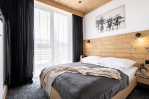 Posteľ alebo postele v izbe v ubytovaní Apartamenty Krupówki 20