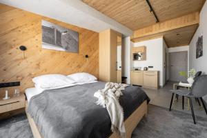 Posteľ alebo postele v izbe v ubytovaní Apartamenty Krupówki 20