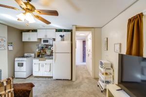 a kitchen with white appliances and a ceiling fan at Pecos Vacation Rental Near Rodeo Arena! in Pecos +17 photos