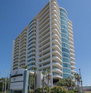 a large building with a sign in front of it at Ocean Front Paradise in Biloxi