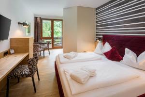 Postel nebo postele na pokoji v ubytování Hotel NockResort