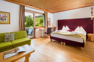 Postel nebo postele na pokoji v ubytování Hotel NockResort