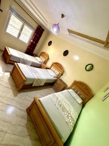 Postel nebo postele na pokoji v ubytování Pret de la corniche