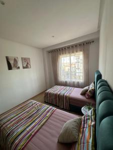 Postel nebo postele na pokoji v ubytování Luxury Family Appart 7 Pers - CheckPoint - Oujda Center