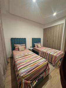 Postel nebo postele na pokoji v ubytování Luxury Family Appart 7 Pers - CheckPoint - Oujda Center