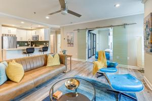 a living room with a couch and chairs at Charming Apartment in Downtown Winston-Salem! in Winston-Salem