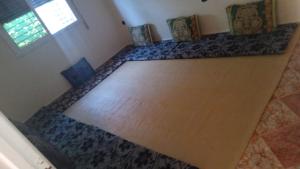 an overhead view of a wooden floor in a room at Appartement dawdi ras el ma in Ras El Ma