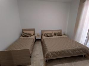 Postel nebo postele na pokoji v ubytování L'Ulivo