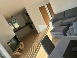 a living room with a couch and a table at Hyde House in Ecclefechan