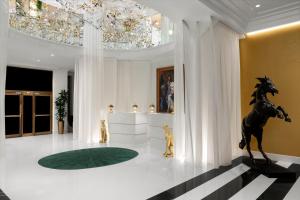 a lobby with a statue of a horse on the floor at The Admiral, Downtown Historic District in Mobile +33 photos