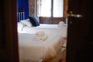 Postel nebo postele na pokoji v ubytování Hotel Rural El Zaguán