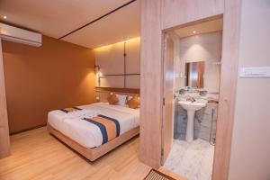 Postelja oz. postelje v sobi nastanitve Hotel Vistara
