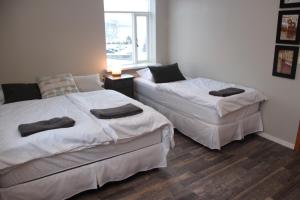 Indigo Guesthouse tesisinde bir odada yatak veya yataklar