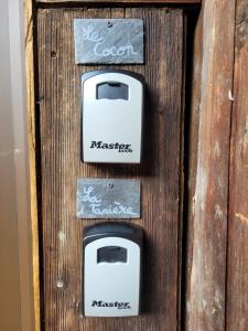 three toasters on a wooden door with writing on them at Chalet Lisa B&B in Morzine