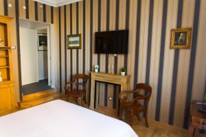 TV a/nebo společenská místnost v ubytování Landlord in Trastevere