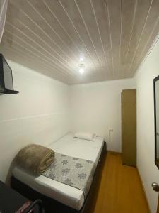 Postel nebo postele na pokoji v ubytování Hostal Casa Primavera