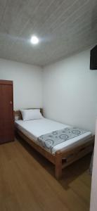 Postel nebo postele na pokoji v ubytování Hostal Casa Primavera