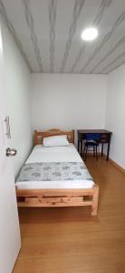 Postel nebo postele na pokoji v ubytování Hostal Casa Primavera