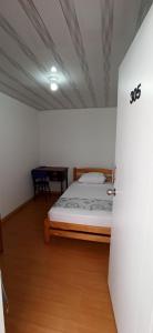 Postel nebo postele na pokoji v ubytování Hostal Casa Primavera