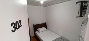 Postel nebo postele na pokoji v ubytování Hostal Casa Primavera