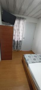 Postel nebo postele na pokoji v ubytování Hostal Casa Primavera