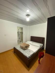 Postel nebo postele na pokoji v ubytování Hostal Casa Primavera