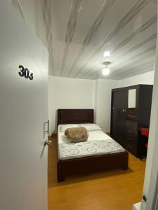 Postel nebo postele na pokoji v ubytování Hostal Casa Primavera